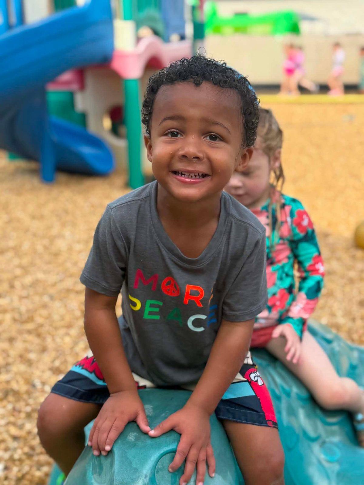 Smiling KCCDC student on the playground